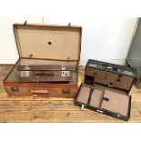 A Finnigans vintage travelling case, with tan leather exterior and the initials S.H.C.L. (21cm x