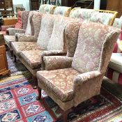 A Parker Knoll three piece wing easy drawing room suite comprising a two seater sofa and a pair of