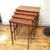 An Edwardian mahogany quartetto set of nesting tables with inlaid chequerboard border tops, on