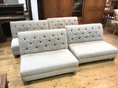 A set of four Oka sectional sofa seats with button backs and oatmeal linen upholstery on square