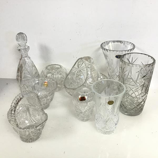 A collection of crystal including baskets, decanter and vases, some stamped Bohemia, Crystal de