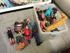 A collection of toy figures including Incredibles, Pirates of the Caribbean, Monsters Inc., The