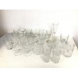 An assortment of glasses including two etched brandy glasses (12cm x 8cm), a cut glass lowball,