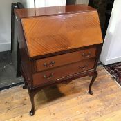 An Edwardian mahogany bureau, with fitted interior, above two drawers, on cabriole supports with pad