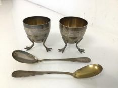 A pair of French silver egg cups both with stylised bird feet, one engraved Jimmy, the other