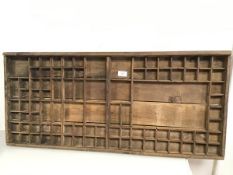 A type setter's tray with compartments (42cm x 90cm)