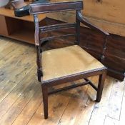 A 19thc Regency style armchair, with curved top rail above a drop in seat, on straight supports