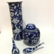 A Chinese blue and white cylinder vase decorated with cherryblossom design, four character mark