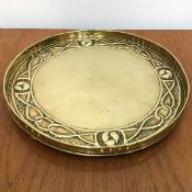 A 1890s/1900 circular brass pierced bordered tray with Mackintosh style boteh quarters, with knot