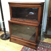 A handsome Globe Wernicke Co. bookcase, with graduated tiers on base fitted single frieze drawer,