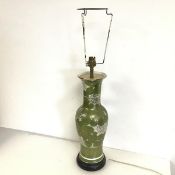 A Japanese baluster vase converted to table lamp, with crysathemum decoration, on ebonised base (