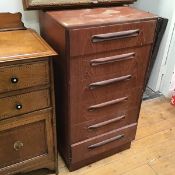 A tall G Plan chest of drawers fitted six graduated drawers on plinth base, makers stamp to interior