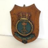 A 1950s ship's metal wall plaque, mounted on wooden shield For the HMS Royal Albert, August 1956,