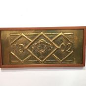 A teak framed rectangular Arts & Crafts embossed brass panel, dated 1902, Providentiae me