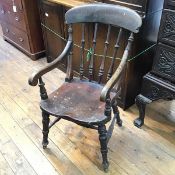 A 19thc elm and ash spindle back chair on turned supports united by H stretcher (91cm x 49cm x