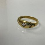 An 18ct single diamond gypsy set ring (3.07g) (O)