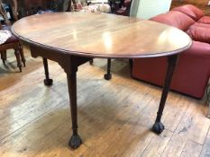A mid-18th century gateleg dining table, the mahogany oval top with twin drop flaps, raised on