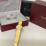A vintage Piaget gentleman's 18ct gold wristwatch, the circular gilt dial with baton markers