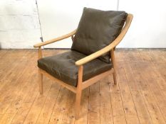 A contemporary elm-framed lounge chair, possibly by Habitat, the turned spar back and downswept arms