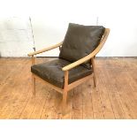 A contemporary elm-framed lounge chair, possibly by Habitat, the turned spar back and downswept arms