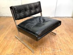 Britian: A 1960's leather armchair, the buttoned back and fitted cushion seat raised on a chrome-