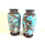 A pair of Japanese cloisonne enamel vases, each of baluster form with everted rim, decorated with