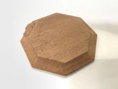 Workshop of Robert "Mouseman" Thompson, a small oak stand or board, octagonal, with carved mouse