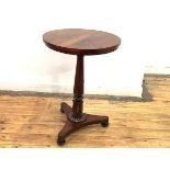 A George IV rosewood occasional table, the circular top raised on a turned lotus-carved pillar