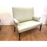 A 19th century mahogany framed two seater settee in George III style, the upholstered back and