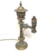 A handsome 19th century brass Colza lamp, the urn-form reservoir with flame finial, the body pierced