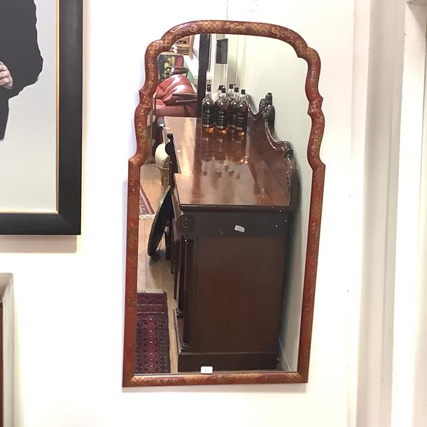 A large Chinoiserie decorated wall mirror in George II style, the shaped rectangular plate within