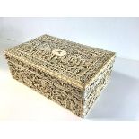 A fine Chinese Export carved ivory work box, Canton, c. 1800, the rectangular box and lift-off cover
