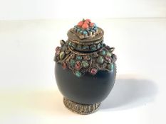 A Sino-Tibetan hardstone snuff bottle, the cover and body mounted in gilt-metal with cabochons in