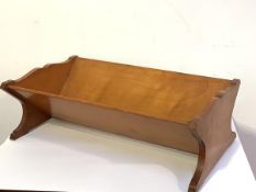 An unusual late 19th century solid sycamore book trough, with undulating sides and moulded feet.