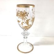 A late 19th century large gilt-decorated glass goblet, the bowl with gilt Japanese-inspired floral