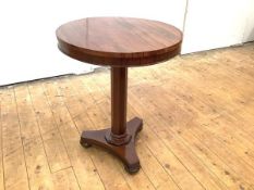 An early Victorian rosewood occasional table, the circular top with moulded frieze raised on an