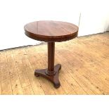 An early Victorian rosewood occasional table, the circular top with moulded frieze raised on an