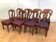 A set of eight late 19th century mahogany dining chairs, each with balloon back, and pierced