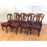 A set of eight late 19th century mahogany dining chairs, each with balloon back, and pierced