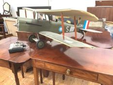 A large model SE5A bi-plane, paper over a wooden carcass, with 4 stroke engine. Length 110cm