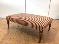 A modern oak framed centre stool, the rectangular seat upholstered in striped fabric, on baluster