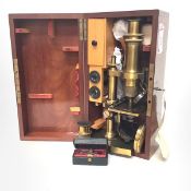 A French late 19th century lacquered brass monocular microscope by Nachet et Fils, Paris, in its