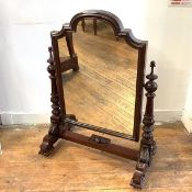 A large mid-19th century cheval dressing mirror, the shaped rectangular plate within a moulded frame