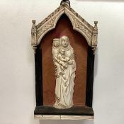 A 19th century carved ivory relief of St. Anne, the Virgin and Child, in late Medieval style, the