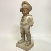 Continental School, c. 1900, Comme Papa , an alabaster figure of a boy in fisherman's cap and boots,