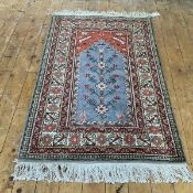 A North-West Persian prayer rug, the grey/blue field with red spandrels within multiple ivory and