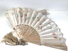 A late 19th century painted and embroidered silk and abalone fan, probably French, painted with