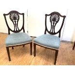 A pair of Edwardian mahogany side chairs, in the style of William and John Linnell, the shield