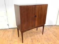 A rosewood cocktail cabinet, 1960's probably Danish, of rectangular form, with a pair of doors