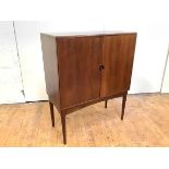 A rosewood cocktail cabinet, 1960's probably Danish, of rectangular form, with a pair of doors